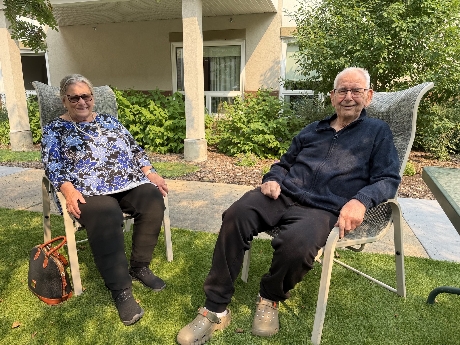 Family seated outdoors